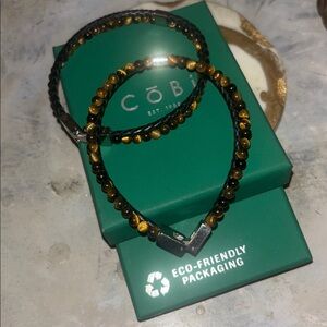 Cobi (Unisex)Tiger Eye / Braided Brown Leather W/ Stainless Steel Clasp